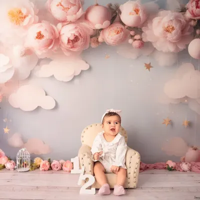 A floral fantasy for a six-month milestone. This dreamy setup with pink peonies and fluffy clouds is perfect for celebrating your little one sitting up on their own.