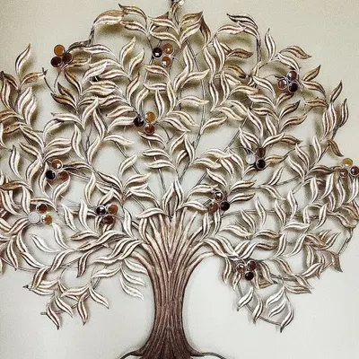 Looking for a unique backdrop? This intricate metal tree of life wall art is available for rent. It's a beautiful and sophisticated piece that can elevate the decor of any event space or serve as a stunning photo background.