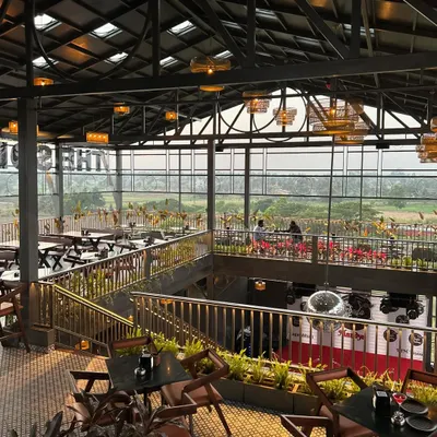 A wide angle of our project at The Soda Factory in Mandya. The plantscaping was designed to complement the open, airy architecture, with greenery lining the upper and lower levels to create a cohesive, natural feel throughout the large space.