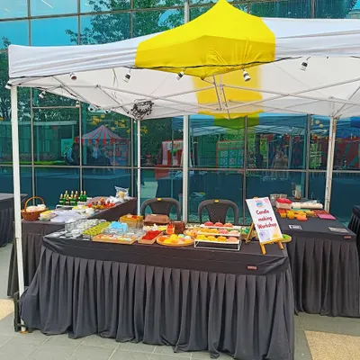 Our live candle making booth setup at an outdoor corporate event at Eco Space, Bangalore. We bring all the materials for guests to create their own candles on the spot.