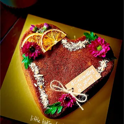 Nothing says I love you better than a heart-shaped cake. This is my orange gulkand nuts cake with a customized topping, perfect for an anniversary.