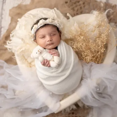 A perfect little soul, wrapped in love and nestled in a heart. This is the essence of my newborn photography, creating pure and angelic portraits.