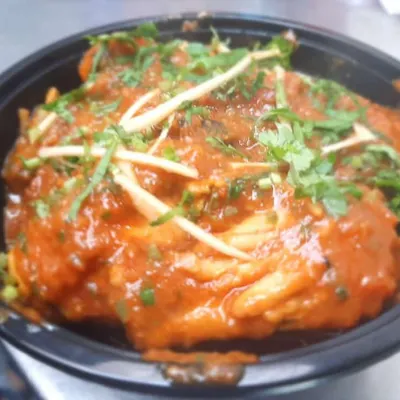 Our special Chicken Adraki, a flavourful curry with a prominent taste of fresh ginger. It's garnished with ginger juliennes and coriander.