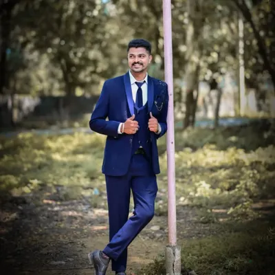 A client looking sharp in a navy blue three-piece suit from my men's rental collection. A timeless choice for any formal occasion.