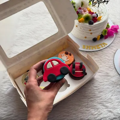 A close-up of one of my custom fondant cupcakes. This little red car was part of a set designed for a car lover's birthday, showing how we can personalize each cupcake to a theme.