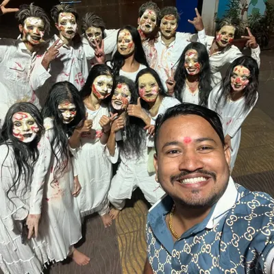 After a show, I took a selfie with these amazing performers in their spooky makeup. It's always fun to collaborate with other artists and entertainers to create a memorable event.