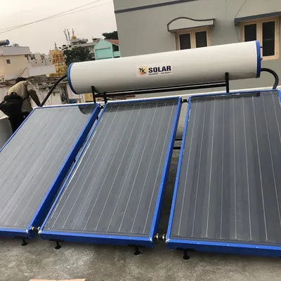 A member of our crew making the final connections between the collector panels and the storage tank. This step is crucial for the thermosiphon process that heats your water using solar energy.