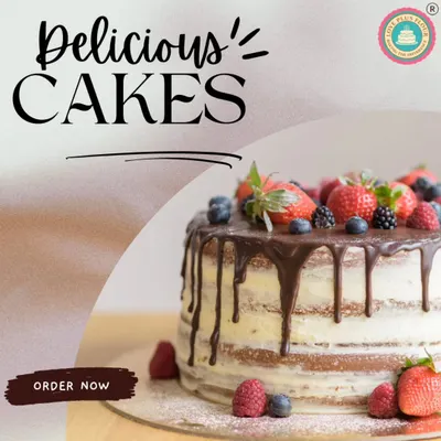 A delicious-looking semi-naked drip cake. This rustic yet elegant design is topped with fresh strawberries, blueberries, and blackberries, with a rich chocolate drip running down the sides.