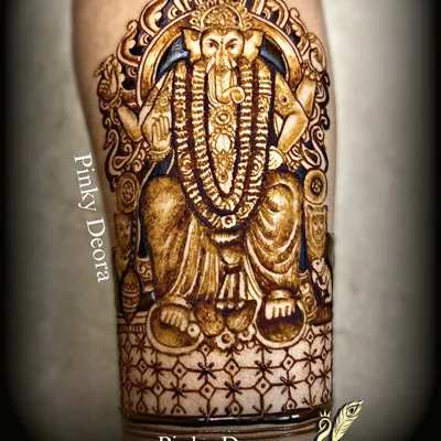 A powerful portrait of Lalbaug Cha Raja, created with immense devotion. This full-arm design captures the majesty and divinity of Bappa, making it a perfect tribute for Ganesh Chaturthi.