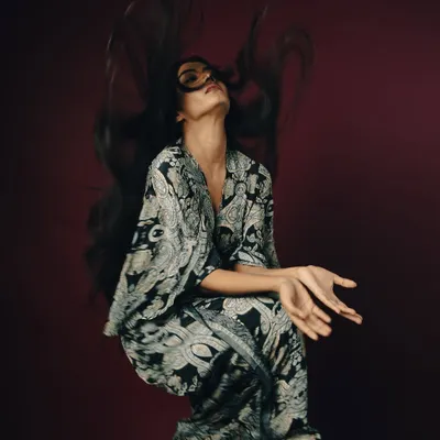 This shot is the definition of capturing movement. I used a fast shutter speed and studio strobes to freeze the model's hair mid-toss, creating a spectacular, gravity-defying shape. It’s a powerful way to showcase volume, texture, and the artistry of hair styling.