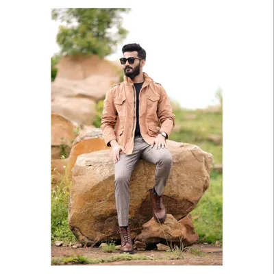 For men's fashion, I focus on capturing a sense of confident, effortless style. This outdoor portfolio shoot combines a rugged natural landscape with a dapper, layered look, creating a compelling commercial image for fashion brands.