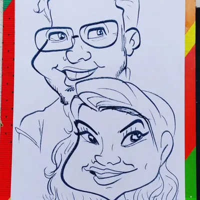 A fun and lively caricature of a smiling couple. I focused on their happy expressions to create a piece full of positive energy.
