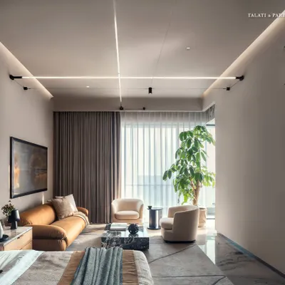 This primary bedroom at Palais Royale is a room of stillness, where serenity takes center stage. A soothing monochromatic palette is layered with soft textures and materials that speak to both comfort and refinement, while expansive windows frame the Arabian Sea.