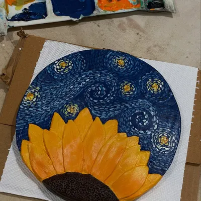 A stunning clay relief piece inspired by Van Gogh, combining the themes of 'Starry Night' and 'Sunflowers'. This was created during one of our open studio sessions.