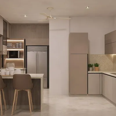 We design kitchens that are practical, functional, and beautiful. This view shows the layout of a modular kitchen with a breakfast counter, ample storage, and integrated appliances, all in a soothing neutral palette.