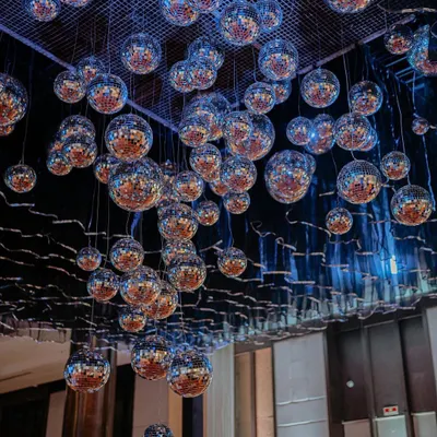 This over-the-top disco ball ceiling was the absolute showstopper of our 'Love & Illusion' Sangeet. It created a dazzling, immersive experience that had everyone looking up in awe. A true stunner.