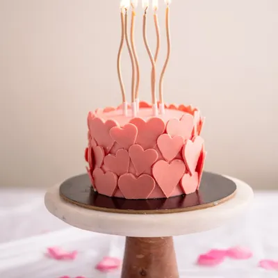 My Valentine's Heart Cake, specially crafted for the season of love. This pink cake is adorned with delicate hearts, making it a beautiful and delicious way to celebrate.