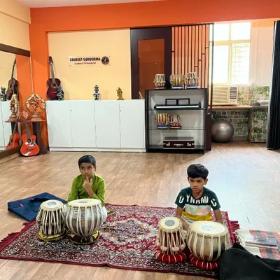 Young learners beginning their journey into the world of percussion with a tabla class. Our teaching method focuses on correct posture and hand techniques from the first day.