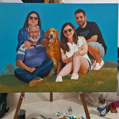 This finished family portrait, including their dog, is displayed on an easel in my studio. The vibrant blue background was chosen by the client to create a modern and cheerful feel for their custom artwork.