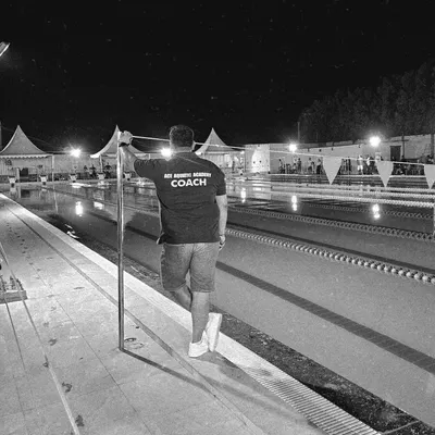 A quiet moment of reflection by the pool after a long day of coaching. My vision is to constantly strive for greatness and create a legacy of success for my swimmers.