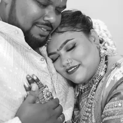 A beautiful, tender moment captured between the couple on their special day. While my main focus is on makeup and nails, my work is all about helping create these happy memories. You can see a hint of the bride's mehendi and nail art as she holds her partner.