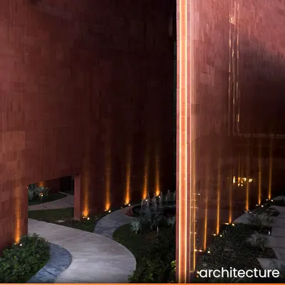 At the Surat Diamond Bourse, the world's largest office building, the landscape is integral to the design. The illuminated pathways and water features within the courtyards create a serene atmosphere at night, extending the usability of these social spaces beyond working hours.