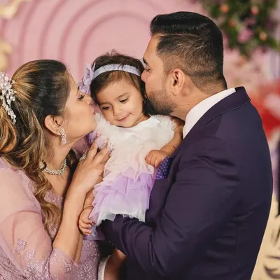 A precious moment with fairy Nia and her parents. The love and happiness in this photo are what make my work so rewarding.