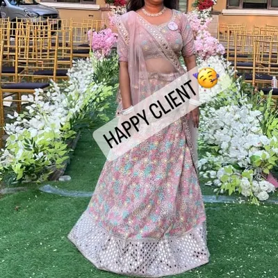 A happy client looking absolutely radiant in a pastel lehenga at a daytime wedding function. Her smile is our biggest reward.