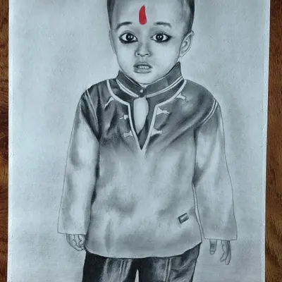 A commissioned portrait of a young boy in a traditional kurta, with the red bindi providing a striking pop of color.