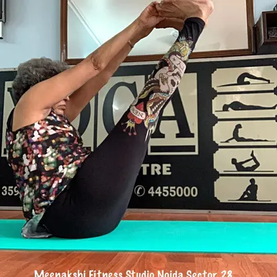 Paripurna Navasana, the full boat pose. This asana is a fantastic workout for the core and hip flexors, which I teach with modifications for all levels.