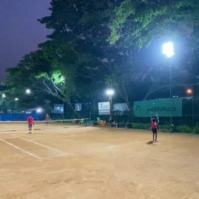 The game continues after sunset. Our courts are fully equipped with floodlights for evening coaching and late-night matches.