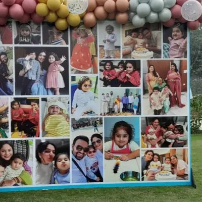 Cherish your memories with a custom photo collage backdrop. This large display, framed by a colorful balloon garland, is a wonderful centerpiece for birthdays, anniversaries, and family gatherings.