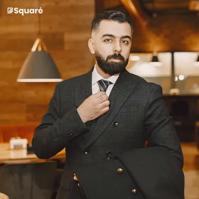 This dark, double-breasted suit is a prime example of my commitment to classic formalwear. The structured shoulders and precise tailoring create a powerful silhouette, perfect for the boardroom or any high-stakes event.