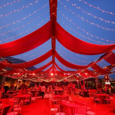 For Sonam & Ross, we created a reception where the stars seemed to descend. This grand gala at Amitarasa featured a red galactic seating area and golden light entrances, transforming the night into a magnificent experience.