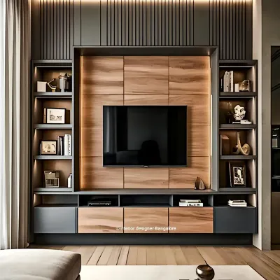 This entertainment center is a perfect example of our mixed-material design approach. We combined dark grey cabinetry with natural wood paneling and integrated vertical shelving, creating a balanced and modern focal point for the living room.