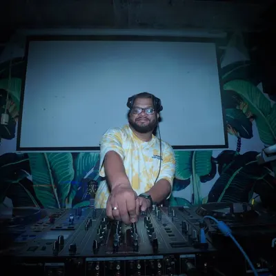 A shot of me at the decks, with a tropical-themed backdrop. This was for the Ashvij Experience.