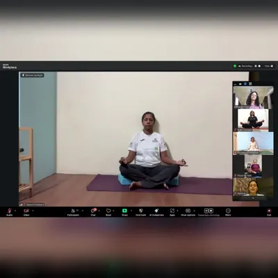 This is a snapshot from one of our online meditation sessions, where I am guiding students through a seated meditation practice. Even through a screen, we create a focused and serene environment for everyone to connect with their inner selves.