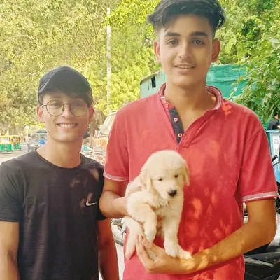 A happy customer's smile is my greatest earning. This young man is taking home a beautiful Golden Retriever puppy, and I know they will have many happy years together.