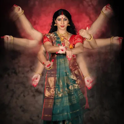 The final image of the Goddess, with multiple arms representing her 'Shakti' or power. This photo from 'The Creation of a Goddess' is the culmination of the narrative, showing the complete transformation from humble clay to the divine.