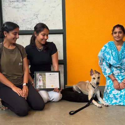 Celebrating Mooli's graduation day! Here she is with her loving family and her well-earned training certificate.
