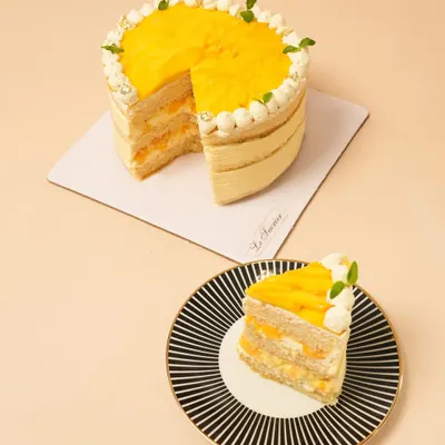 My Mango Vanilla Cream Cake is a true taste of summer. It features layers of light sponge, fresh mango puree, and vanilla cream, topped with more juicy mango.