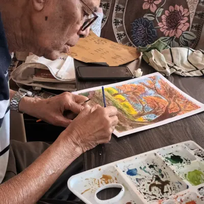 My student, Prafulla sir, who at 85 years old, is a perfect example that passion for art has no age limit. Here he is, fully engaged in his watercolour painting.