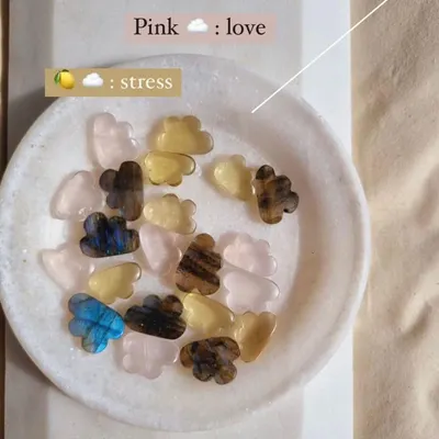 These are my 'candy clouds', carved from different gemstones. Blue Labradorite for magic, pink Rose Quartz for love, and yellow Lemon Quartz for stress relief.