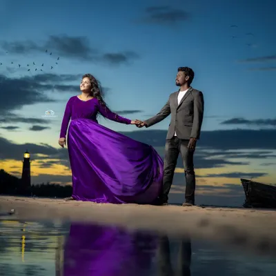I love how this purple velvet and satin gown looks against the sunset. It's a perfect choice for a romantic pre-wedding shoot, offering a rich color and a fabric that catches the light beautifully.