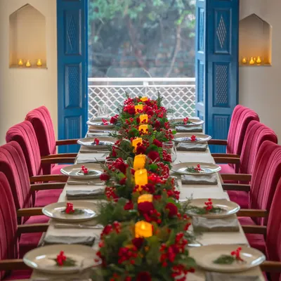 A Christmas feast awaits. I can arrange a beautifully decorated long table for your group, complete with festive centerpieces and candles, creating a warm and merry atmosphere.