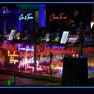 The bar for this neon-themed party was a work of art. I designed it with custom neon signs featuring fun and personal phrases, creating a vibrant and interactive centerpiece for the celebration.