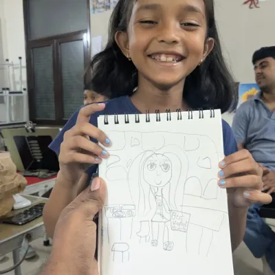 This is what we love to see. One of our youngest, Naomika, drew this in her sketchbook and named it 'best student'. Her dedication to practicing art at this age is truly inspiring.