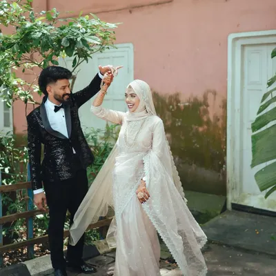 A spontaneous dance in the middle of the street. These are the moments that truly show a couple's personality and love. This was captured during a beautiful Muslim wedding in Kerala.