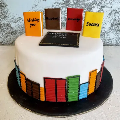 The perfect cake for the bookworm in your life. This design features a library of edible books with custom titles like "Happiness" and "Success," celebrating a 35th birthday.