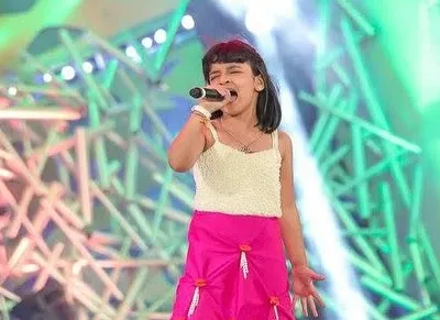 This is me at nine years old, performing on the Super Singer Junior stage. That year-long journey taught me so much about different genres, performing under pressure, and connecting with an audience through television.